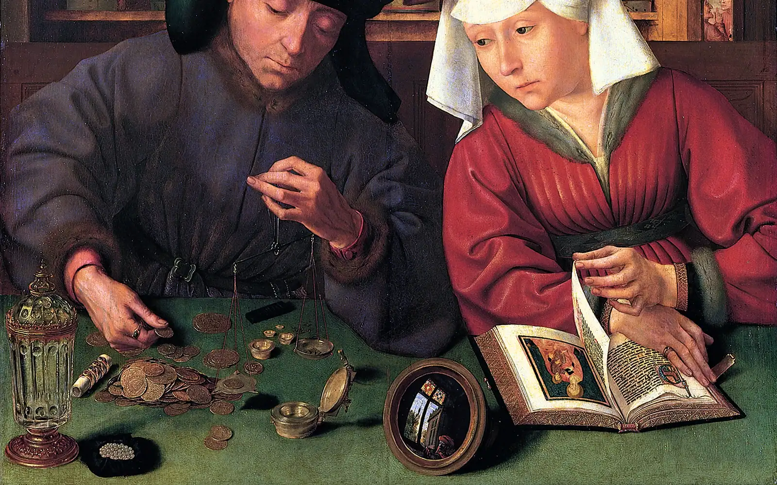 Quinten Metsys's The Moneylender and his Wife: a man weighs gold coins on a small balance while his wife, turning the pages of an illuminated book, watches the coins.
